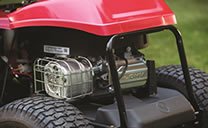 The best 30" riding lawn mower's OHV engine positioned at the back of the Troy-Bilt mower