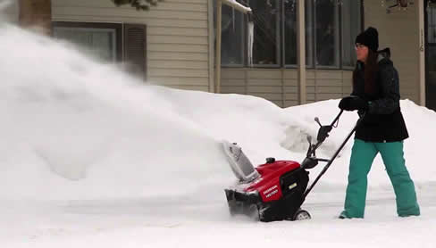 Honda HS720ASA snow blower in action